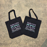 Flat lay of black cotton tote on concrete background