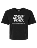 Black cropped motivational tee with white peace quote – front